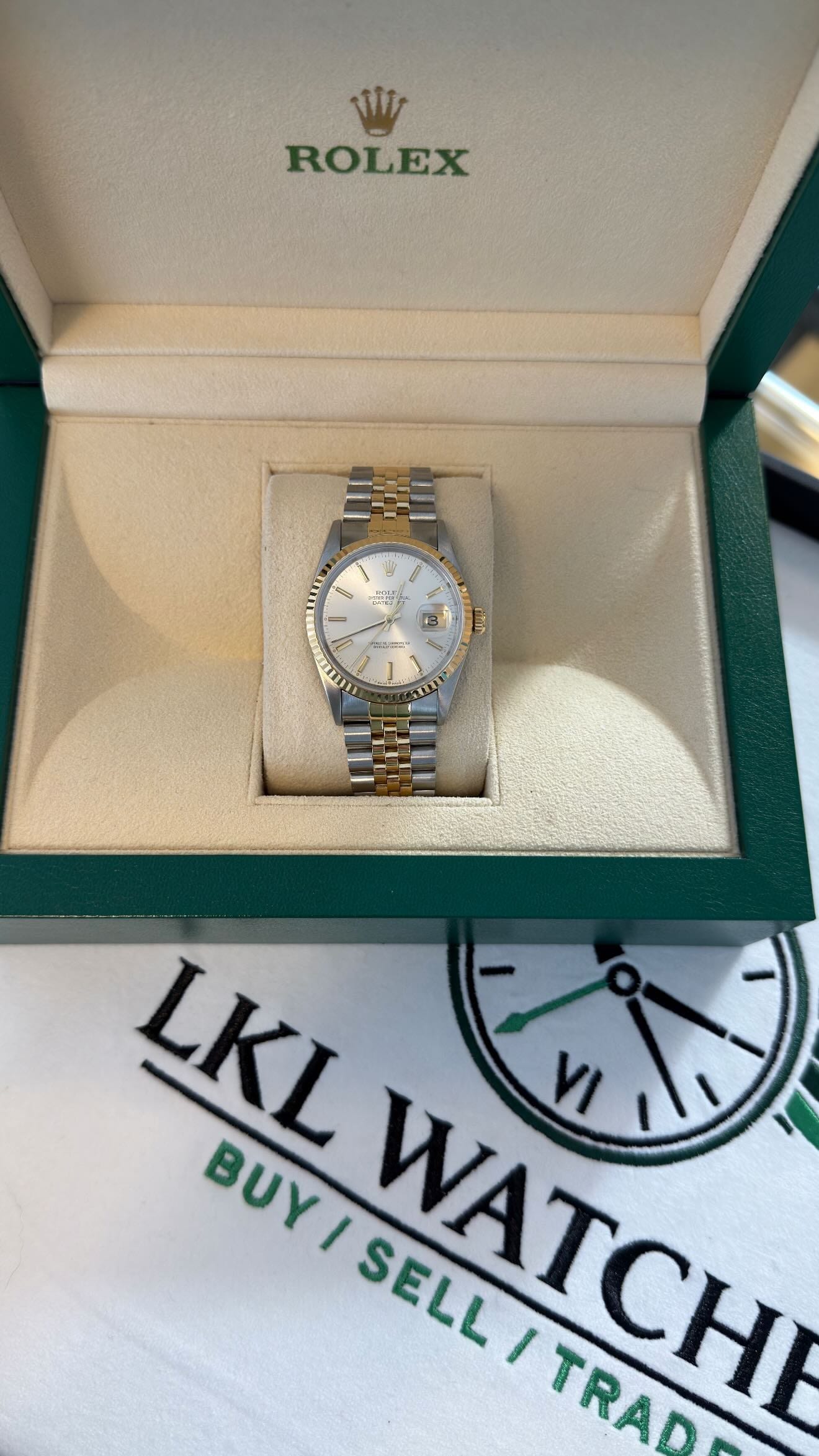 A Rolex with its box and papers