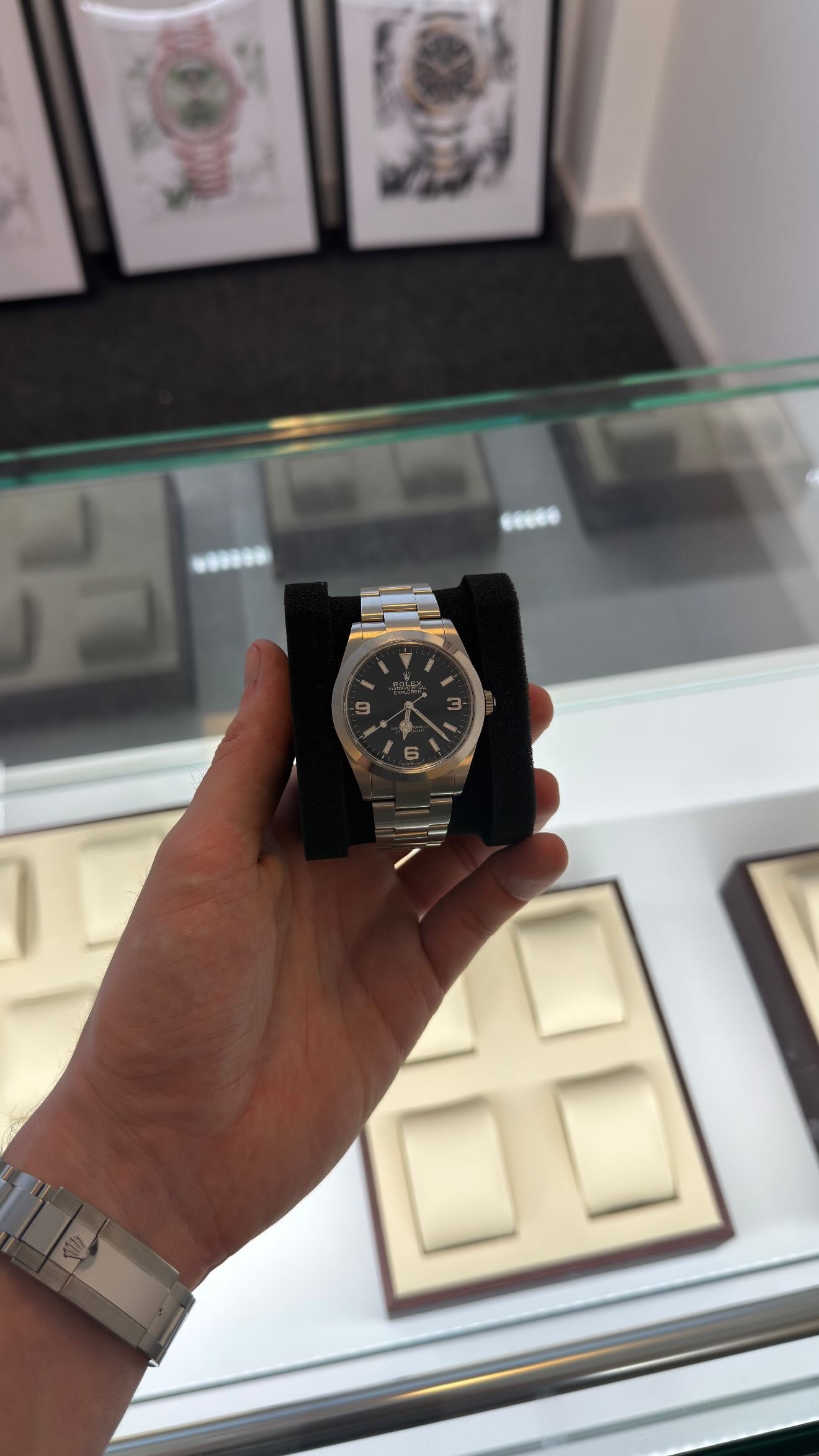 A Rolex Explorer with a black dial